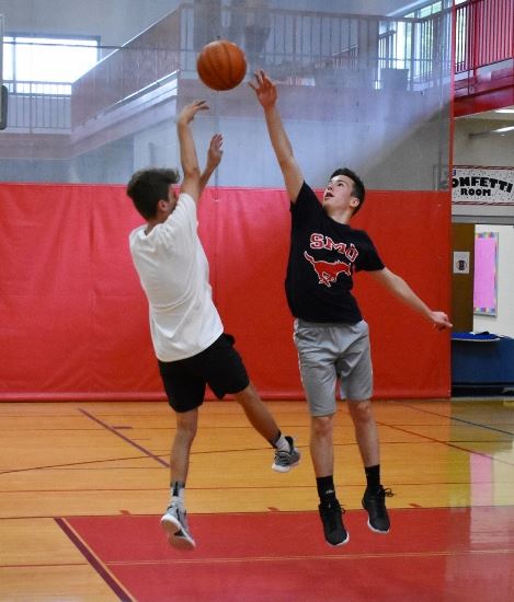 Boys playing basketball