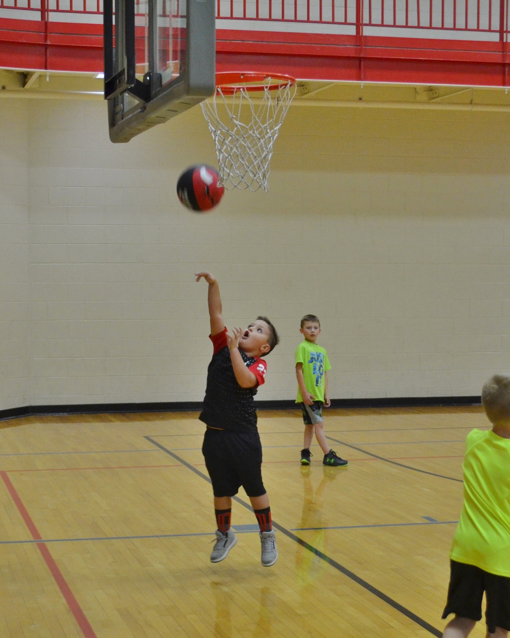 Boy shooting a basketball.JPG