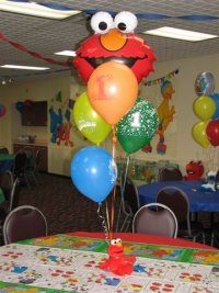 Elmo balloons at a birthday party